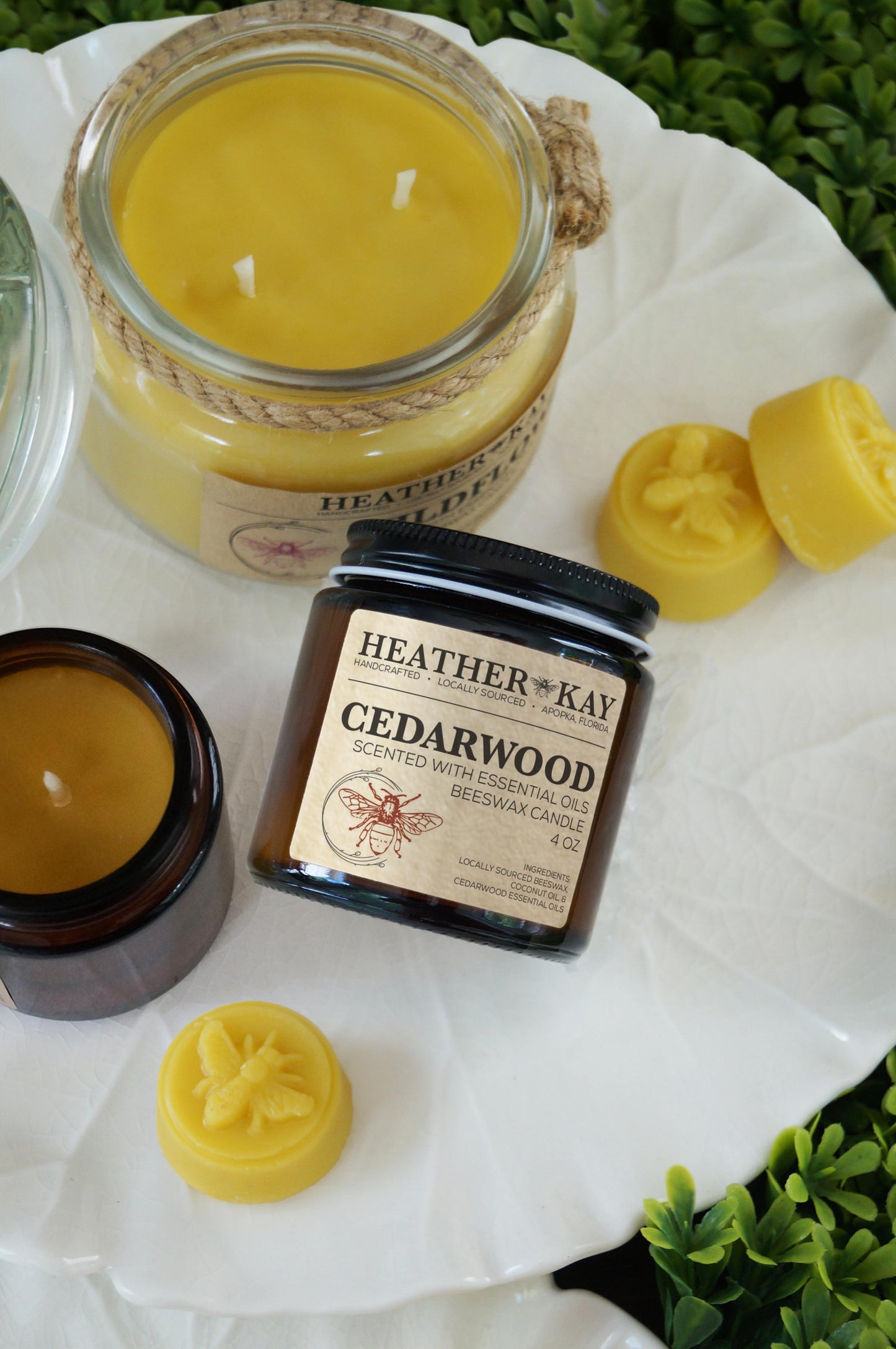 Cedarwood Beeswax Candle with Beeswax Candles in the background on a earthy background